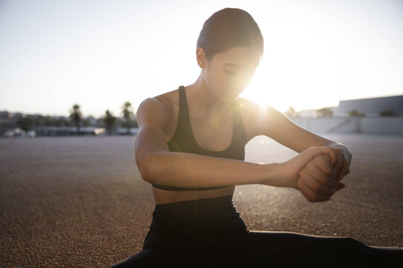 young-woman-stretching-preparing-exercise-outdoors.jpg